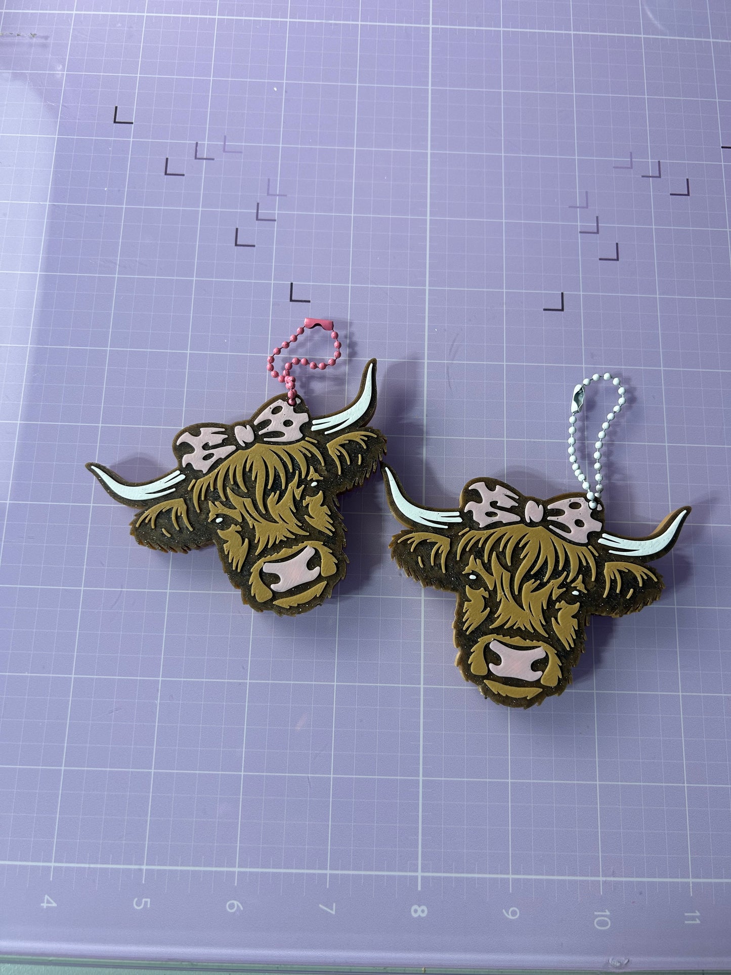 3-D printed Highlander cow can opener keychain